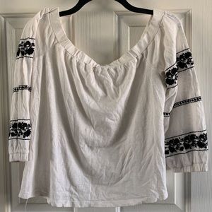 Cream Top With Black Patterns On Sleeves